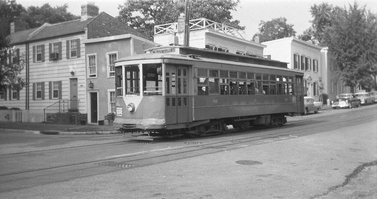 Trolley passes pebble dash stucco house in Washington, DC