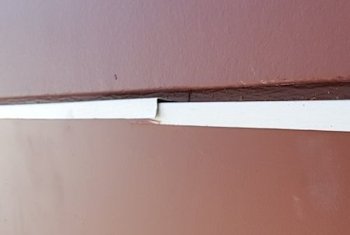 Paint peeling off PVC trim.