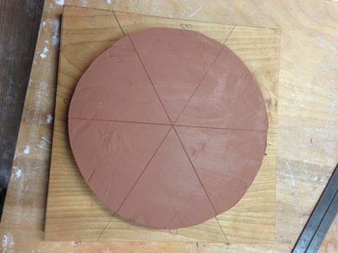 Clay is shaped into a circle