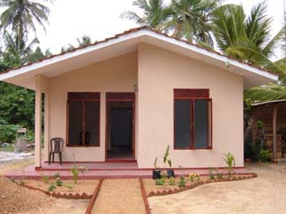 Donald Stevens
                uses stucco to rebuild houses in Sri Lanka