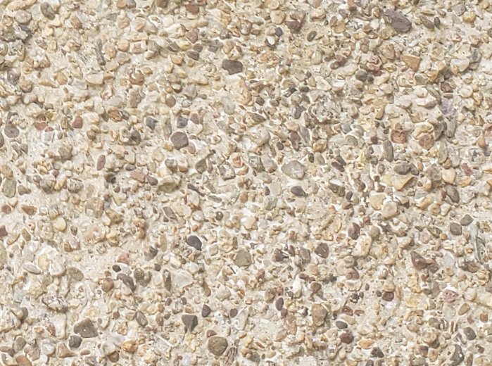 close up of unpainted pebble dash stucco in Washington, DC.