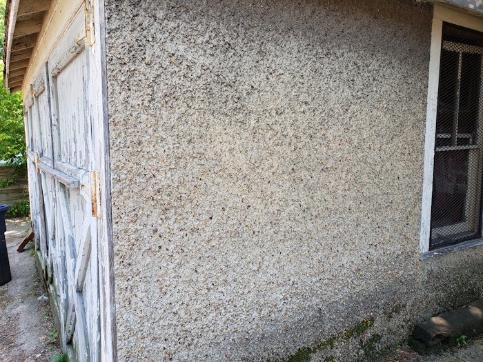 Unpainted stucco garage in Mount Pleasant area of Washington, DC