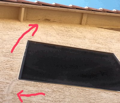 Recently painted eaves (soffits) are already peeling, indicating a roof leak, perhaps due to a cracked tile.